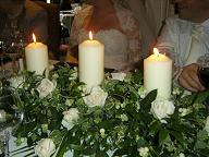The top table's flowers/candle arrangement
